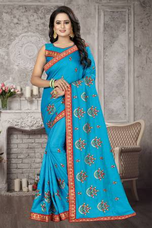 Bright And Appealing Shade Is Here With This Designer Saree In Blue Color. This Saree And Blouse are Fabricated On Satin Silk Beautified With Jari And Resham Embroidery With Stone Work. Its Pretty Embroidered Motifs Are Adding More Beauty To It. 