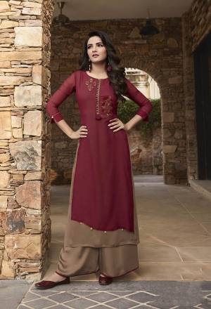 Here Is An Elegant Looking Readymade Pair Of Kurti and Plazzo In Maroon And Beige Color. Its Top Is Fabricated on Georgette And Soft Silk Paired With Soft Silk Fabricated Plazzo. It Is Light In Weight And Easy To Carry All Day Long. 