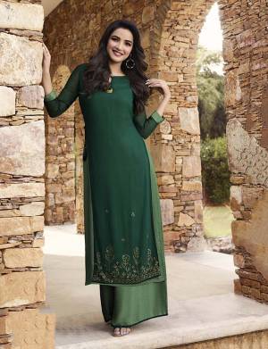 This Festive Season Be The Most Unique Of all Wearing This Readymade Pair Of Kurti and Plazzo In Dark Green And Green Color. It IS Fabricated On Georgette And Soft Silk Beautified With Stone Work. 