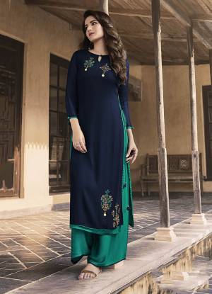 Here Is An Elegant Looking Readymade Pair Of Kurti and Plazzo In Navy Blue And Sea Green Color. Its Top Is Fabricated on Georgette And Soft Silk Paired With Soft Silk Fabricated Plazzo. It Is Light In Weight And Easy To Carry All Day Long. 