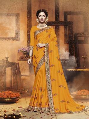 Celebrate This Festive Season With Beauty and Comfort Wearing This Designer Saree In Musturd Yellow Color. This Saree Is Fabricated On Satin Silk Paired With Art Silk Fabricated Dupatta. It IS Beautified With Contrasting Embroidered Motifs All Over With Lace Border Giving It an Attractive Look. 