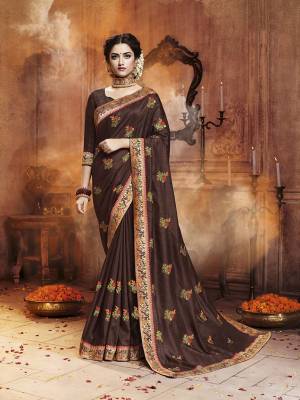 Celebrate This Festive Season With Beauty and Comfort Wearing This Designer Saree In Brown Color. This Saree Is Fabricated On Satin Silk Paired With Art Silk Fabricated Dupatta. It IS Beautified With Contrasting Embroidered Motifs All Over With Lace Border Giving It an Attractive Look. 
