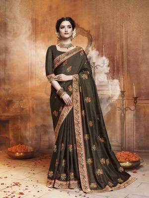 Celebrate This Festive Season With Beauty and Comfort Wearing This Designer Saree In Coffee Brown Color. This Saree Is Fabricated On Satin Silk Paired With Art Silk Fabricated Dupatta. It IS Beautified With Contrasting Embroidered Motifs All Over With Lace Border Giving It an Attractive Look. 