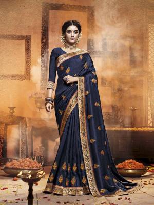 Celebrate This Festive Season With Beauty and Comfort Wearing This Designer Saree In Navy Blue Color. This Saree Is Fabricated On Satin Silk Paired With Art Silk Fabricated Dupatta. It IS Beautified With Contrasting Embroidered Motifs All Over With Lace Border Giving It an Attractive Look. 