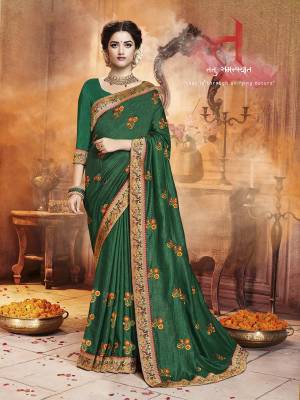Celebrate This Festive Season With Beauty and Comfort Wearing This Designer Saree In Green Color. This Saree Is Fabricated On Satin Silk Paired With Art Silk Fabricated Dupatta. It IS Beautified With Contrasting Embroidered Motifs All Over With Lace Border Giving It an Attractive Look. 