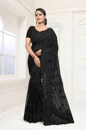 For A Bold And Beautiful Look, Grab This Heavy Embroidered Saree In Black Color. This Saree And Blouse are Fabricated On Net Beautified with Heavy Resham Embroidery And Moti Work In Tone To Tone Thread Color. Buy This Saree Now.
