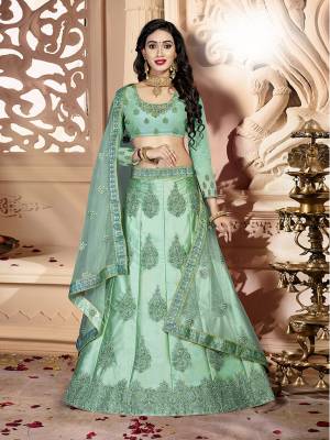 Grab This Rich And Elegant Looking Heavy Designer Lehenga Choli In Mint Green Color. Its Blouse Is fabricated On art Silk Paired With Satin Silk Lehenga And Net Fabricated Dupatta. It Is Beautified With Heavy Jari And Resham Embroidery With Stone Work. Buy This Pretty Piece Now.