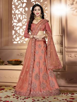 Grab This Rich And Elegant Looking Heavy Designer Lehenga Choli In Rust Orange Color. Its Blouse Is fabricated On art Silk Paired With Satin Silk Lehenga And Net Fabricated Dupatta. It Is Beautified With Heavy Jari And Resham Embroidery With Stone Work. Buy This Pretty Piece Now.