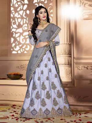 Grab This Rich And Elegant Looking Heavy Designer Lehenga Choli In Grey Color. Its Blouse Is fabricated On art Silk Paired With Satin Silk Lehenga And Net Fabricated Dupatta. It Is Beautified With Heavy Jari And Resham Embroidery With Stone Work. Buy This Pretty Piece Now.