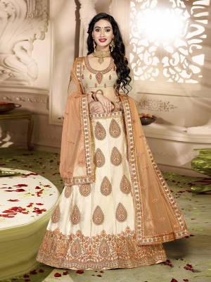 Grab This Rich And Elegant Looking Heavy Designer Lehenga Choli In Peach Color. Its Blouse Is fabricated On art Silk Paired With Satin Silk Lehenga And Net Fabricated Dupatta. It Is Beautified With Heavy Jari And Resham Embroidery With Stone Work. Buy This Pretty Piece Now.