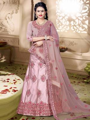 Grab This Rich And Elegant Looking Heavy Designer Lehenga Choli In Dusty Pink Color. Its Blouse Is fabricated On art Silk Paired With Satin Silk Lehenga And Net Fabricated Dupatta. It Is Beautified With Heavy Jari And Resham Embroidery With Stone Work. Buy This Pretty Piece Now.
