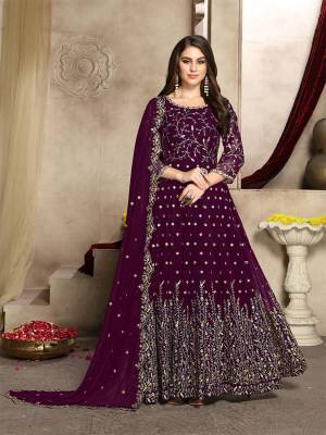 Here Is A Prefect Outfit For This Festive And Wedding Season Wearing This Heavy Designer Floor Length Suit In Wine Color. Its Embroidered Floor Length Top And Dupatta are fabricated on Georgette Paired With Santoon Bottom. It Is Light In Weight and Easy To Carry All Day Long. Buy Now.