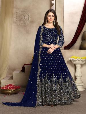 Here Is A Prefect Outfit For This Festive And Wedding Season Wearing This Heavy Designer Floor Length Suit In Navy Blue Color. Its Embroidered Floor Length Top And Dupatta are fabricated on Georgette Paired With Santoon Bottom. It Is Light In Weight and Easy To Carry All Day Long. Buy Now.