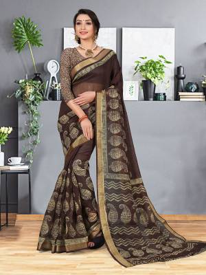 Simple and Elegant Looking Designer Printed Saree Is Here In Brown Color. This Saree And Blouse are fabricated On Cotton Silk beautified With Prints And Weaved Lace Border. It Is Light In Weight and easy To Carry all Day Long. 