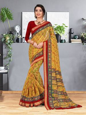 Simple and Elegant Looking Designer Printed Saree Is Here In Yellow Color Paired With Red Colored Blouse. This Saree And Blouse are fabricated On Cotton Silk beautified With Prints And Weaved Lace Border. It Is Light In Weight and easy To Carry all Day Long. 