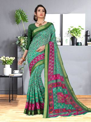 Simple and Elegant Looking Designer Printed Saree Is Here In Green Color. This Saree And Blouse are fabricated On Cotton Silk beautified With Prints And Weaved Lace Border. It Is Light In Weight and easy To Carry all Day Long. 