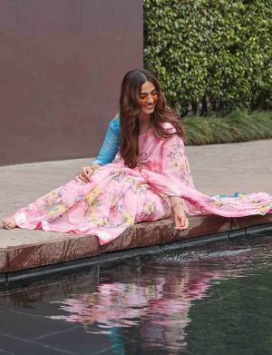 Look Pretty In This Beautiful Floral Printed Designer Saree In Pink Color Paired With Contrasting Blue Colored Blouse. This Saree And Blouse are Fabricated On Soft Linen Which IS Light Weight And Easy To Carry All Day Long. 