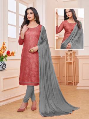 Here Is Pretty Colorful Suit To add Into Your Wardrobe With This Designer Dress Material In Rust Red Colored Top Paired With Contrasting Grey Colored Bottom And Dupatta. Its Top Is Satin Linen Based Paired With Cotton Bottom and Chinon Fabricated Dupatta. 