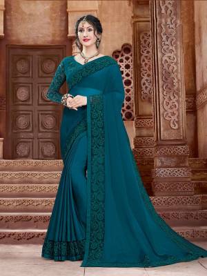 Shine Bright In This Attractive Looking Designer Saree In Teal Blue Color. This Saree And Blouse Are Fabricated On Georgette Beautified With Subtle Tone To Tone Embroidery. Buy This Saree Now.