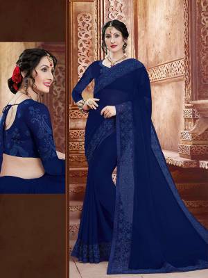 Shine Bright In This Attractive Looking Designer Saree In Royal Blue Color. This Saree And Blouse Are Fabricated On Georgette Beautified With Subtle Tone To Tone Embroidery. Buy This Saree Now.