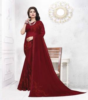 For A Royal Look, Grab This Designer Saree In Maroon Color Paired With Maroon Colored Blouse. This Saree Is Satin Georgette Paired With art Silk Fabricated Blouse. It Is Light In Weight And Easy To Carry All Day Long. 