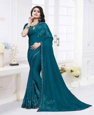 Add This Lovely Shade To Your Wardrobe With This Designer Saree In Blue Color. This Saree Is Fabricated On Satin Georgette Paired With Art Silk Fabricated Blouse. It Is Beautified With Attractive Minimal Embroidery. Buy Now.