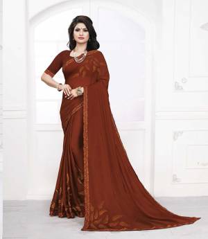 For A Royal Look, Grab This Designer Saree In Rust Brown Color Paired With Maroon Colored Blouse. This Saree Is Satin Georgette Paired With art Silk Fabricated Blouse. It Is Light In Weight And Easy To Carry All Day Long. 