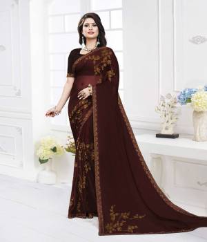 Flaunt Your Rich And Elegant Taste Wearing This Designer Rich Looking Saree In Dark Brown Color. This Saree Is Fabricated On Satin Georgette Paired With Art Silk Fabricated Blouse. Both Its Fabrics are Soft Towards Skin And Ensures Superb Comfort All Day Long. 