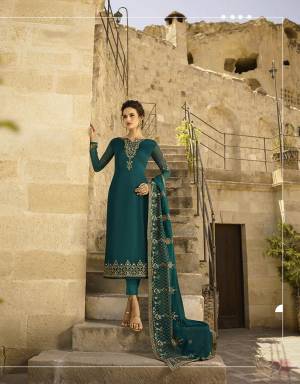 New Shade Is Here To Add Into Your Wardrobe With This Designer Straight Suit In All Over Teal Blue Color. Its Embroidered Top Is Fabricated On Satin Georgette Paired With Santoon Bottom Paired With Santoon Bottom And Heavy Embroidered Georgette Fabricated Dupatta. 