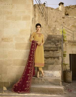 Celebrate This Festive Season Wearing This Very Beautiful Heavy Designer Straight Suit In Occur Yellow Color Paired With Contrasting Maroon Colored Dupatta. Its Top IS Fabricated On Satin Georgette Paired With Santoon Bottom And Georgette Fabricated Dupatta. It Is Beautified With Attractive Jari And Resham Work. Buy Now.