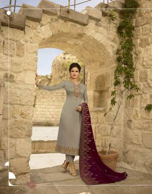 Flaunt Your Rich And Elegant Taste In This Very Beautiful Heavy Designer Straight Suit In Grey Color Paired With Contrasting Maroon Colored Dupatta. Its Top Is Satin Georgette Based Paired With Santoon Bottom And Georgette Fabricated Heavy Dupatta. 