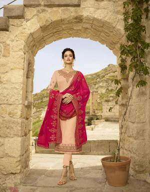 You Will Definitely Earn Lots Of Compliments Wearing This Heavy Designer Straight Suit In Peach Color Paired With Contrasting Rani Pink Colored Dupatta. Its Top IS Fabricated On Satin Georgette Paired With Santoon Bottom And Georgette Fabricated Dupatta. It Has Pretty Embroidery Over The Top And Dupatta.