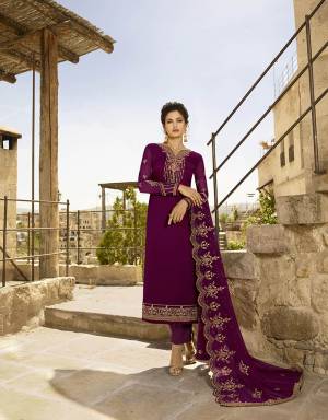Add Glam To Your Wardrobe With This Designer Straight Suit In All Over Wine Color. Its Embroidered Top Is Fabricated On Satin Georgette Paired With Santoon Bottom Paired With Santoon Bottom And Heavy Embroidered Georgette Fabricated Dupatta. 