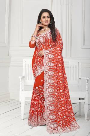Get Ready For The Upcoming Wedding Season With This Heavy Designer Saree In Orange Color. This Saree And Blouse Are Fabricated On Georgette. This Saree Is Suitable For Wedding And Festive Wear. Buy This Heavy Attractive Saree Now.