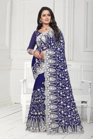 Get Ready For The Upcoming Wedding Season With This Heavy Designer Saree In Navy Blue Color. This Saree And Blouse Are Fabricated On Georgette. This Saree Is Suitable For Wedding And Festive Wear. Buy This Heavy Attractive Saree Now.