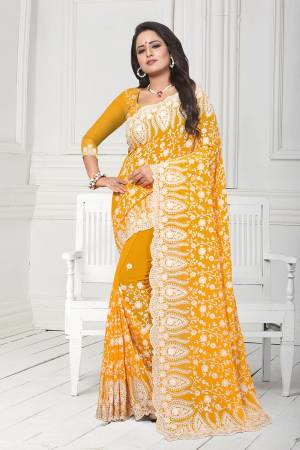Get Ready For The Upcoming Wedding Season With This Heavy Designer Saree In Yellow Color. This Saree And Blouse Are Fabricated On Georgette. This Saree Is Suitable For Wedding And Festive Wear. Buy This Heavy Attractive Saree Now.
