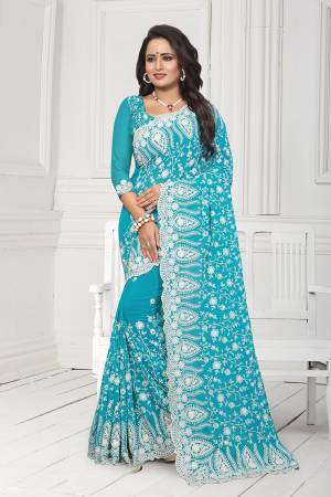 Get Ready For The Upcoming Wedding Season With This Heavy Designer Saree In Blue Color. This Saree And Blouse Are Fabricated On Georgette. This Saree Is Suitable For Wedding And Festive Wear. Buy This Heavy Attractive Saree Now.