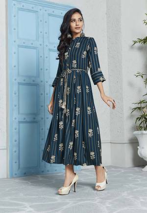 For Your Semi-Casuals, Grab This Designer Readymade Kurti In Navy Blue And Grey Color Fabricated On Rayon. It Is Beautified With Prints All Over. Its Rich Color And Elegant Pattern Will earn You Lots Of Compliments From Onlookers. 