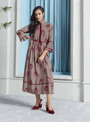 Flaunt Your Rich And Elegant Taste In This Designer Readymade Kurti In Grey Color Fabricated On Rayon. This Kurti Is Beautified With Pretty Motif Prints All Over It. 