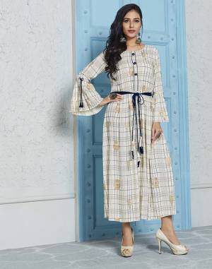 Simple And Elegant Looking Designer Readymade Kurti Is Here In Off-White Color. This Pretty Checks Printed Kurti Is Fabricated On Rayon With Foil Printed Motifs. 