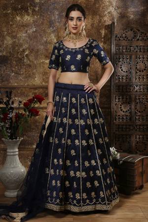Enhance Your Personality Wearing This Heavy Designer Lehenga Choli In All Over Navy Blue Color. This Rich Embroidered Lehenga Choli Is Silk Based Paired With Net Fabricated Dupatta. It Is Durable And Easy Carry Throughout The Gala.