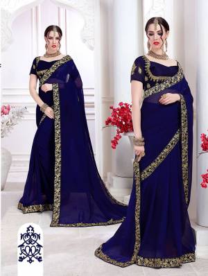 Enhance Your Personality Wearing This Designer Saree In Navy Blue Color. This Saree Is Chiffon based Paired With Art Silk Fabricated Blouse. Its Blouse And Saree Lace Border Are Beautified With Attractive Embroidery Work. 