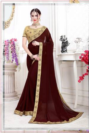 Catch All The Limelight Wearing This Pretty Designer Saree With Heavy Blouse Concept, Its In Brown Color Paired with Beige Blouse. This Saree Is Chiffon Based Paired with art Silk Fabricated Blouse. 