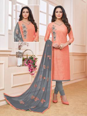 Celebrate This Festive Season With Beauty And Comfort Wearing This Designer Straight Suit In Peach Color Paired With Contrasting Grey Colored Bottom And Dupatta. Its Top Is Fabricated On Art Silk Paired With Cotton Bottom And Chiffon Dupatta. 