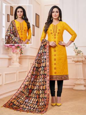 Here Is A Dress Material In Musturd Yellow And Black Color. Its Top Is Fabricated on Art Silk Paired With Cotton Bottom And Soft Silk Fabricated Digital Printed Dupatta. Get This Stitched As Per Your Desired Fit And Comfort. 