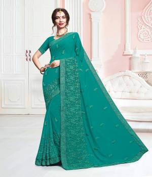 Add This Beautiful Designer Saree To Your Wardrobe In Sea Green Color. This Saree And Blouse Are Georgette Based Beautified With Tone To Tone Embroidery Which Gives A Subtle And Heavy Look Both At The Same Time.