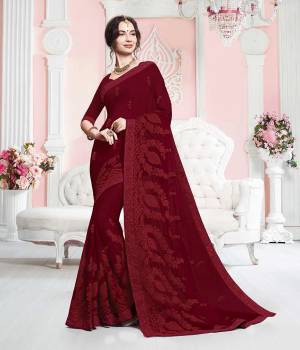 Celebrate This Festive Season In Traditionals Wearing This Designer Saree In Maroon Color. This Saree Is Georgette Based Beautified With Subtle Tone To Tone Embroidery. Buy This Pretty Saree Now.