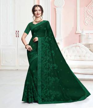 Add This Beautiful Designer Saree To Your Wardrobe In Dark Green Color. This Saree And Blouse Are Georgette Based Beautified With Tone To Tone Embroidery Which Gives A Subtle And Heavy Look Both At The Same Time.