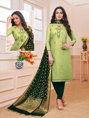 Flaunt Your Rich And Elegant Taste Wearing This Designer Straight Suit In Light Green Color Paired With Dark Green Colored Bottom And Dupatta. Its Top Is Fabricated On Linen Satin Paired With Cotton Bottom And Banarasi Art Silk Dupatta. Buy This Dress Material Now.