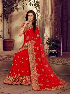 For The Upcoming Wedding Season, Here Is a Perfectly Suitable Saree In Red Color Paired With Red Colored Blouse. This Saree And Blouse Are fabricated On Georgette Beautified With Embroidery Highlighted With Stone Work. Buy This Beautiful Designer Saree Now.